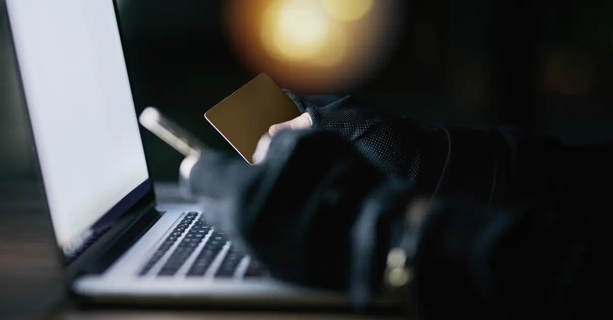Someone is using a laptop to steal data.